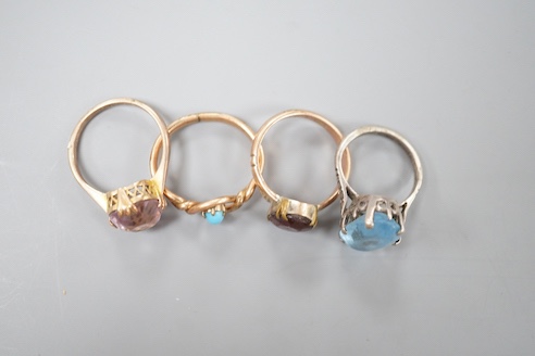 Two 9ct dress rings and two other rings including gilt metal and paste set.